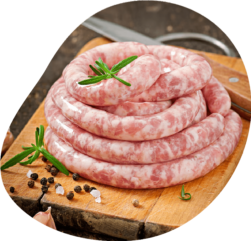 Fresh raw sausage on the old wooden background<br />
